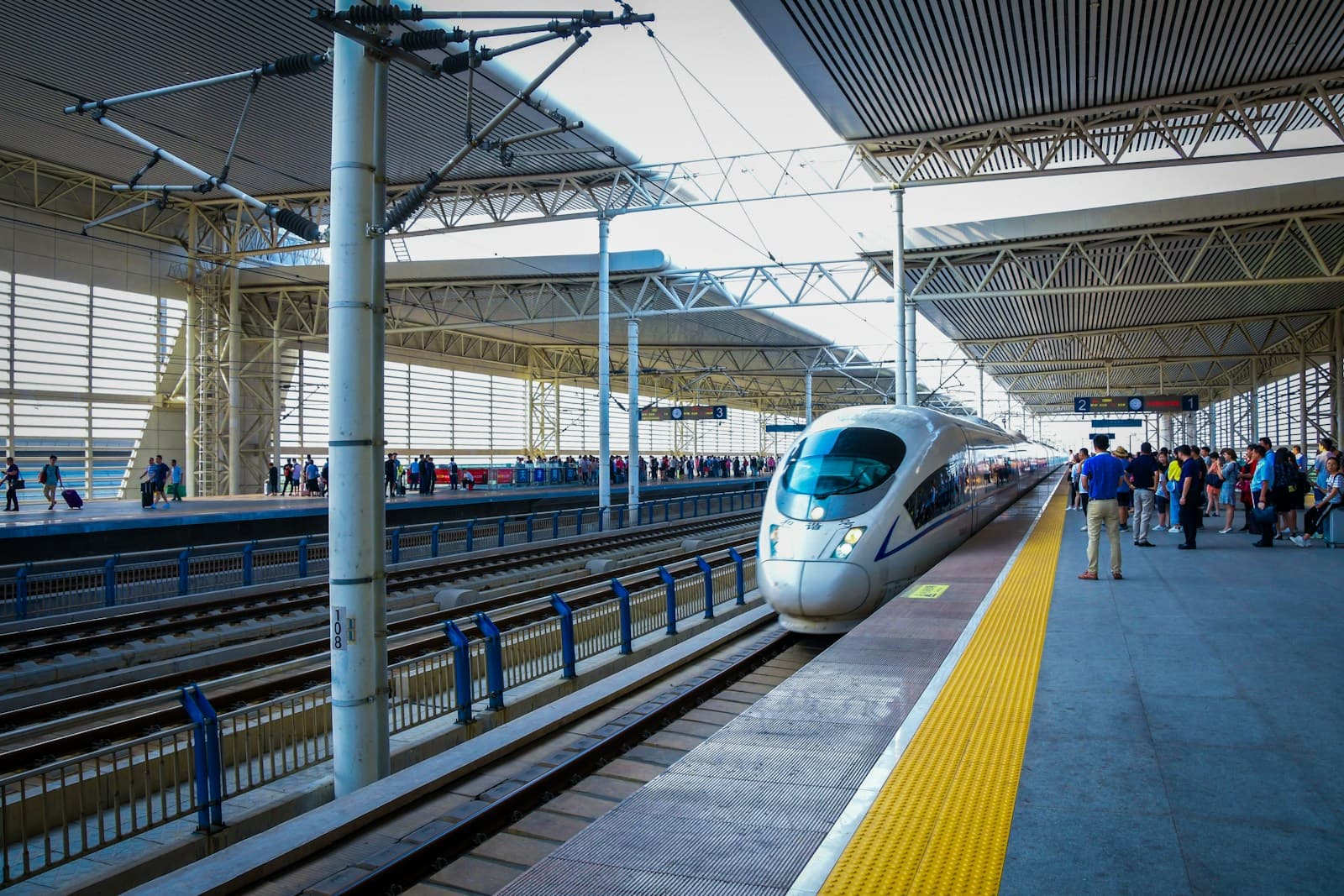 High-speed train arriving at a station platform in China